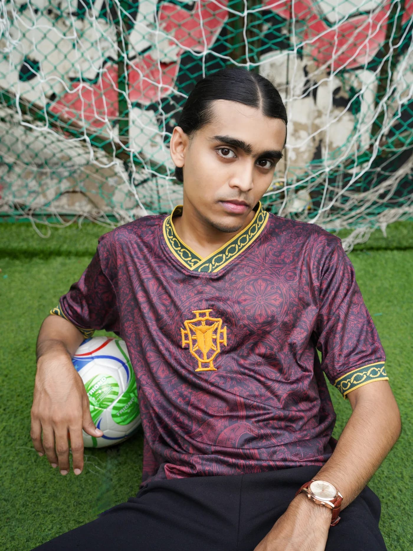 Model in the Saudade jersey by the goal